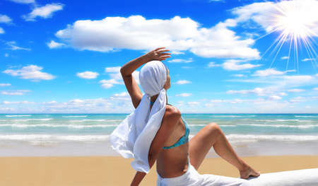 woman relaxing in the afternoon by the seaの写真素材