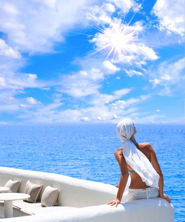 woman relaxing in the afternoon by the seaの写真素材