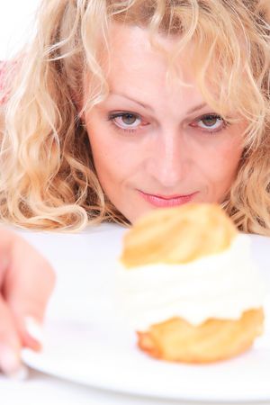 Hungry gluttonous woman eating cake
