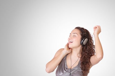 Beautiful young woman with headphones  Listening to Music
の写真素材