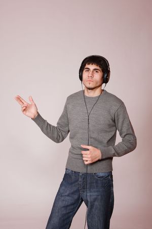 Young man listening music with headphonesの写真素材