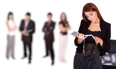 A business woman leading a team in the officeの写真素材