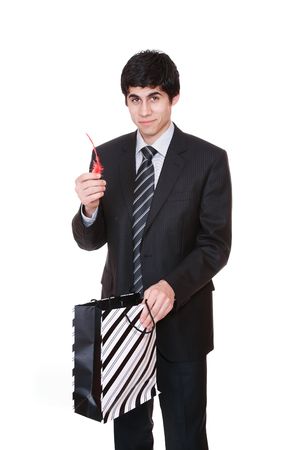 Happy shopping man. Isolated over white background

の写真素材