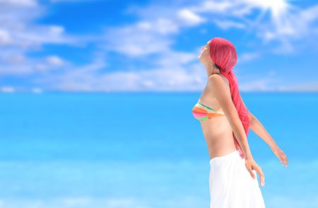 Beautiful young woman relaxing by the beach in Greece

の写真素材