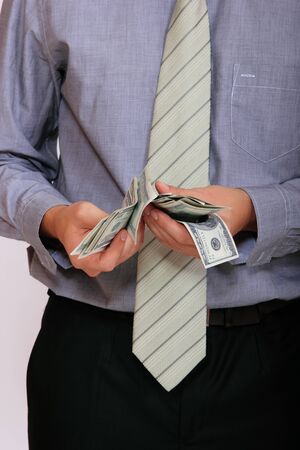 business man with money in his handsの写真素材