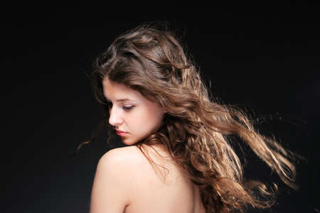 Portrait of glamour woman over dark gray backgroundの写真素材