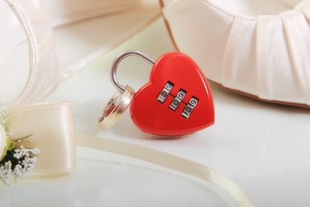 Elegant wedding shoes composition with heart shaped lock