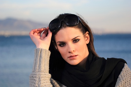 portrait of a beautiful young woman at the sea