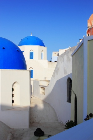 Traditional Greek white church  in village Oia of Cyclades Island Santorini Greeceの写真素材