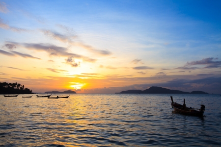 Beautiful sunrise in Rawai Phuket island Thailand with Long tailed boat Ruea Hang Yaoの写真素材