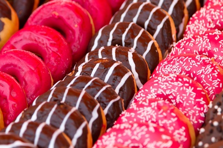 Batch of fresh baked donutsの写真素材