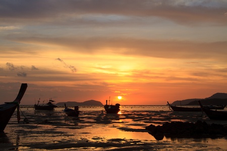 Beautiful sunrise in Rawai Phuket island Thailand with Long tailed boat Ruea Hang Yaoの写真素材