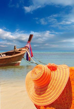 Straw hat and Long tailed boat in Phuket Thailandの写真素材
