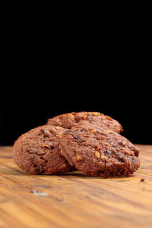 Homemade Chocolate cookies on a wooden plankの写真素材