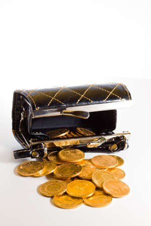 Purse with gold coins over white backgroundの写真素材
