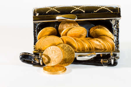 Purse with gold coins over white backgroundの写真素材