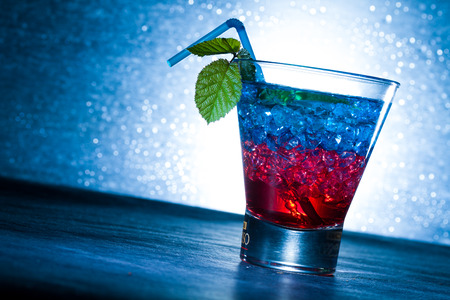 Layered cocktail with blue and red at the clubの写真素材