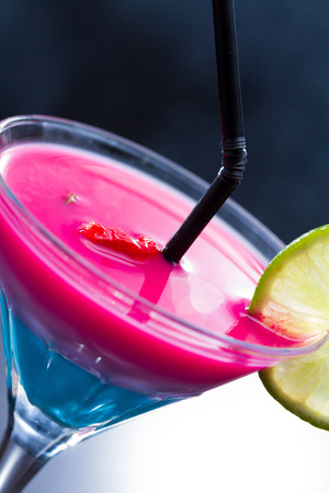 Fresh tropical layered cocktail with red hot chilly pepperの写真素材