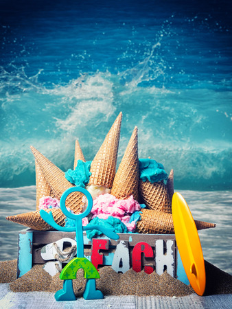 Two Icecreams cone in a box on the beachの写真素材