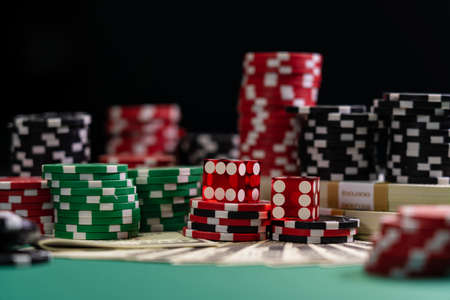 Casino red Craps dice with USD 100 bills - Shallow depth of field
