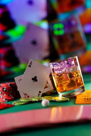 Craps dice in cocktail glass on the casino gambling tableの写真素材