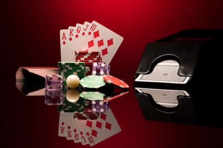 Casino set with Roulette, cards, dice and chips on BlackJack mat