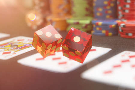 Poker game and rlling dices at the casino gambling table