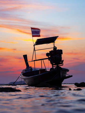 Traditional long-tail boat on the beach in Thailandの写真素材
