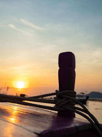 Traditional long-tail boat on the beach in Thailandの写真素材