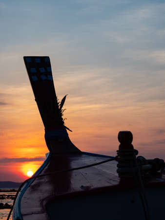 Traditional long-tail boat on the beach in Thailandの写真素材