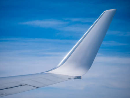 Flying over the clouds Inflight airplane wingの写真素材