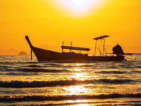 Traditional long-tail boat on the beach in Thailandの写真素材