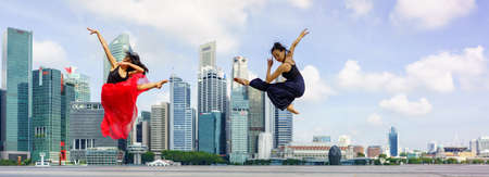 Skilled Dancers in front of the Singapore skylineのeditorial素材