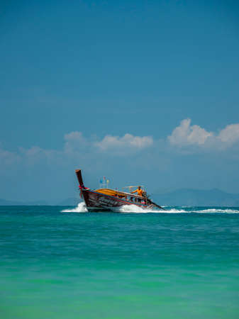Ao Nang, Thailand - FEBRUARY 18, 2019: Traditional long tail boat on Ao Nang beach in Krabi Thailandのeditorial素材