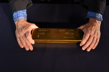 Gold bar from the gold reserve of Russia. Words in the photo: Russia. In the photo there are not translated technical designations.の写真素材