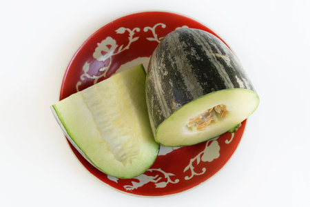 A juicy Uzbek melon cut in half.の写真素材