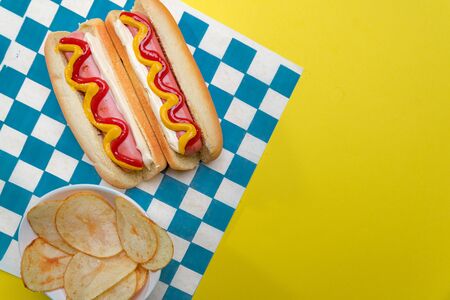 classic hot dogs with ketchup and mustard with space for creatorsの写真素材