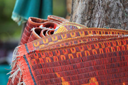 Traditional plastic mat on beach, Thailandの写真素材