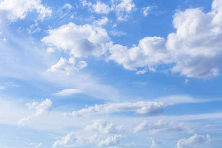 White cloudy on blue sky background in sunshineの写真素材