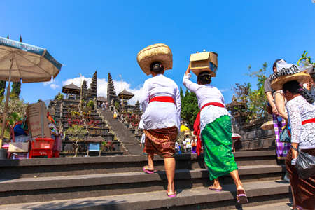 Bliness woman bear the offering for celebration to god in Besakih temple, Bali, Indonesiaのeditorial素材