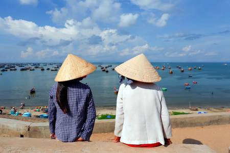 Vietnamese woman sitting at fisherman village, Muine, Vietnamの写真素材