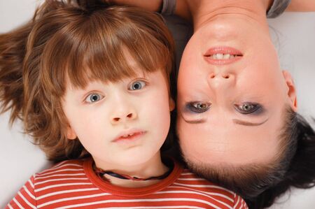 happy family lying on floorの写真素材