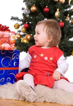 cute  girl over christmas treeの写真素材