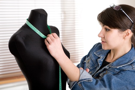 young adult fashion designer at work