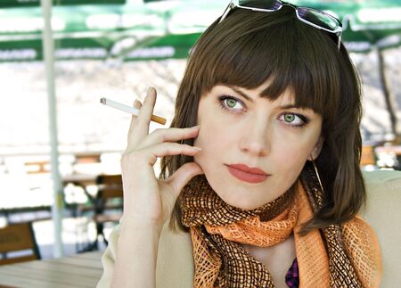 Young woman with a cigaretteの写真素材