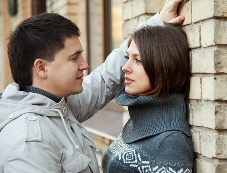 Attractive young couple in love looking into each others eyesの写真素材