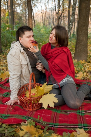 Young couple on picnic  in the autumn forest の写真素材