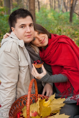 Young couple on picnic  in the autumn forestの写真素材