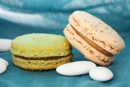 Tasty macaroons with candiesの写真素材
