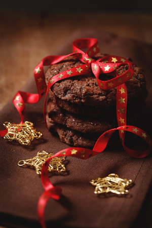 Christmas chocolate cookies tied with the ribbonの写真素材